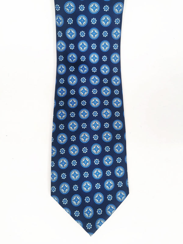 Corbata azul marino con medallones y flores celestes