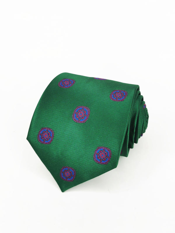 Corbata verde con medallas azul y fucsia